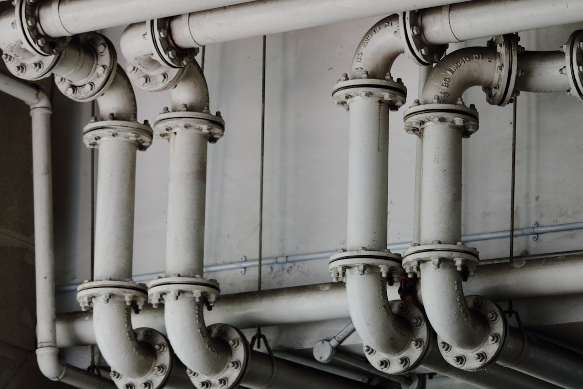 Close-up of engineered industrial pipe flanges and fittings